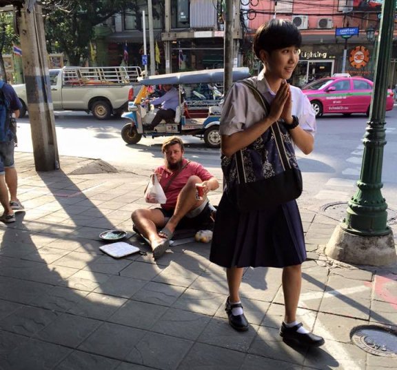 Foreigner begging on the street in Thailand